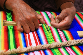 woman in guatemala creating handmade dog collars with colorful weave woman in guatemala creating handmade dog collars with colorful weave